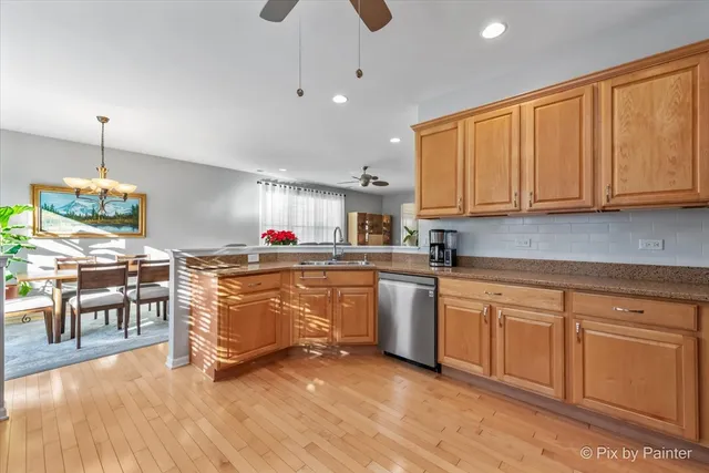 a kitchen with granite countertop a sink cabinets and window