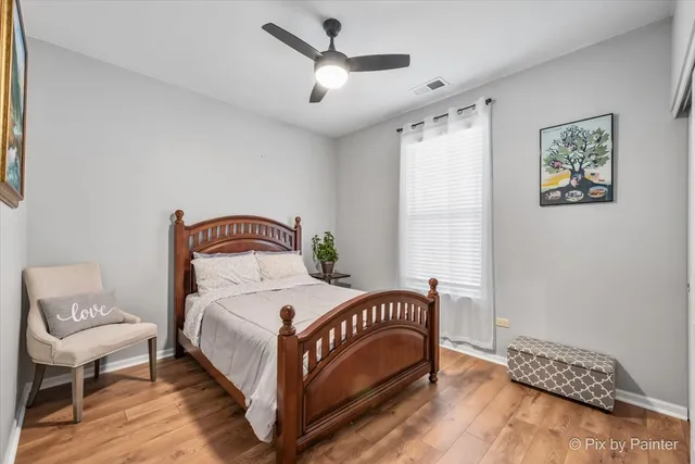 a bedroom with a bed and a chair