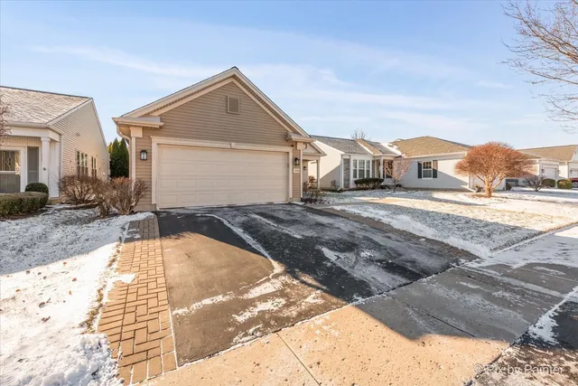 a view of a house with a snow in the yard