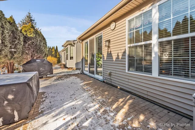 a view of a house with a yard and sitting area
