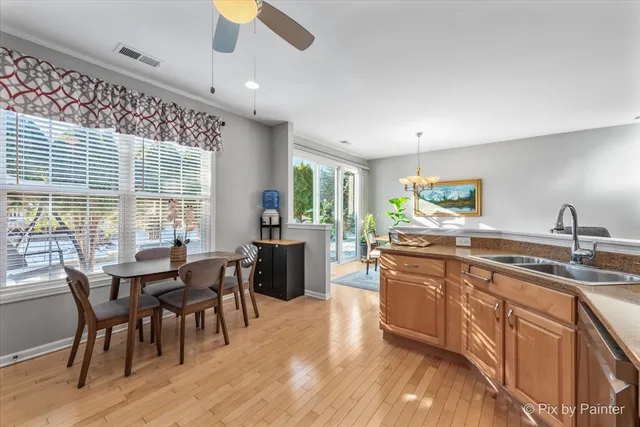 a kitchen with lots of counter top space and dining table