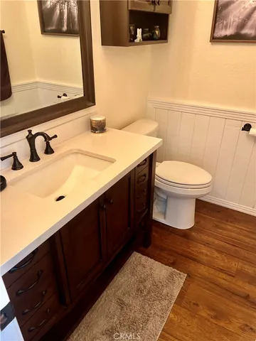a kitchen with stainless steel appliances granite countertop a refrigerator and a stove
