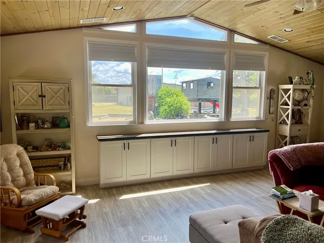 a kitchen with stainless steel appliances a stove refrigerator sink and microwave