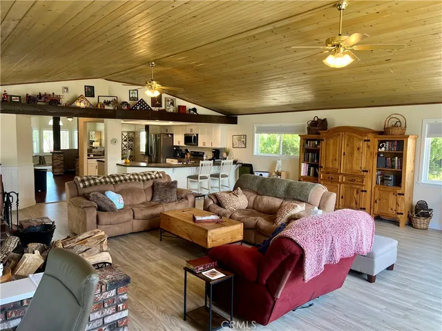a spacious bathroom with a tub sink and mirror