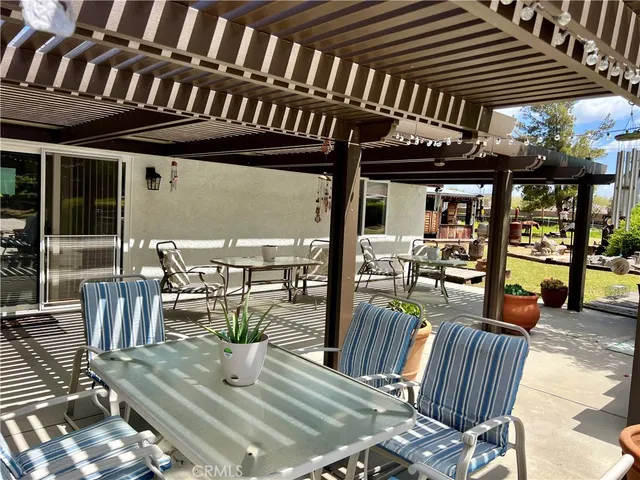 a view of a chairs and tables in patio
