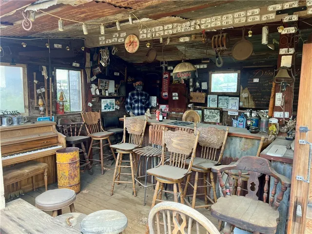 a view of an house with backyard space and balcony