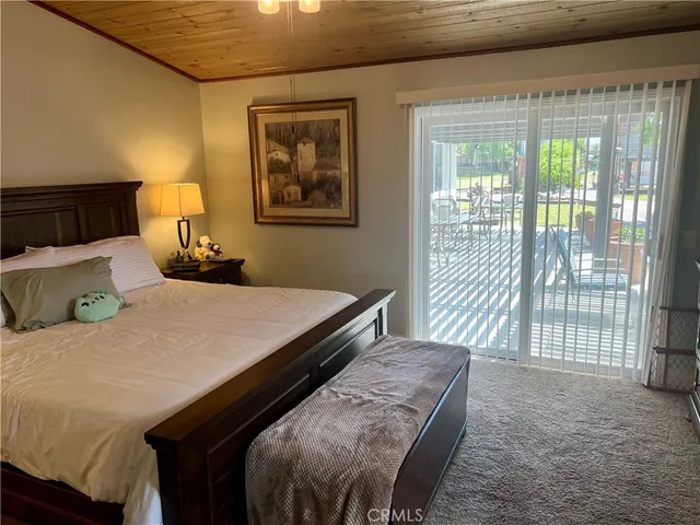 a view of an house with backyard space and balcony