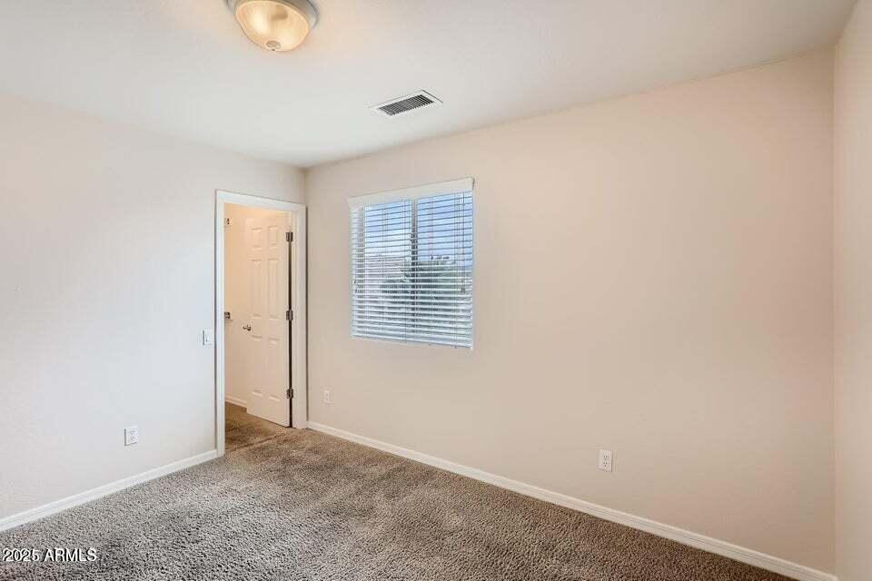 2039 West Kathleen Road Phoenix, AZ 85023 - Photo 22 of 33 a view of an empty room with a window