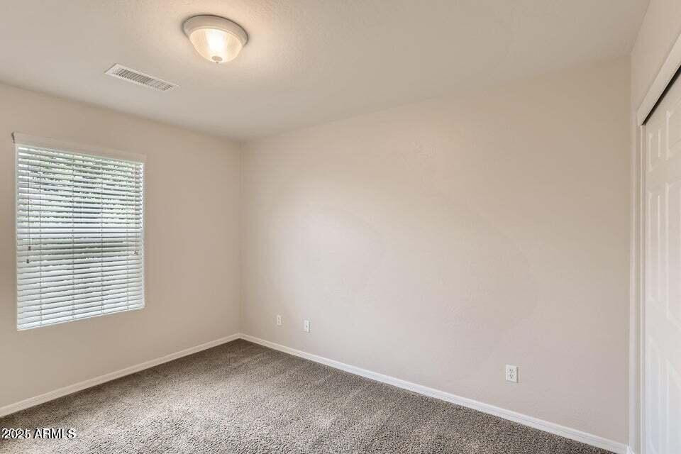 2039 West Kathleen Road Phoenix, AZ 85023 - Photo 23 of 33 an empty room with a window