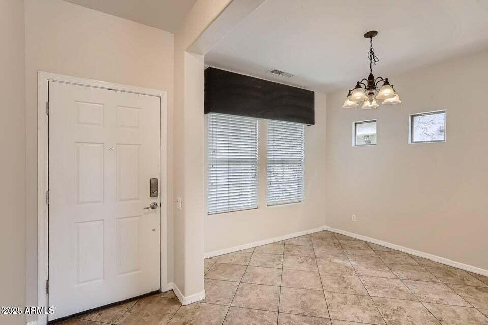 2039 West Kathleen Road Phoenix, AZ 85023 - Photo 5 of 33 a view of an empty room with a window