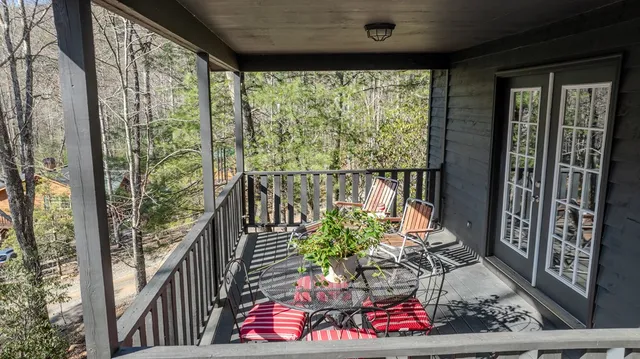 a view of balcony with wooden floor