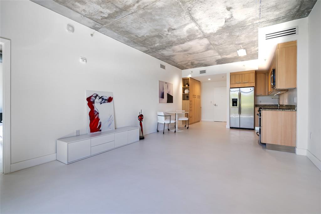 2001 Meridian Avenue, Unit 318 Miami Beach, FL 33139 - Photo 14 of 37 a living room with furniture and a couch