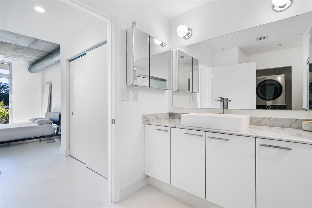 2001 Meridian Avenue, Unit 318 Miami Beach, FL 33139 - Photo 23 of 37 a kitchen with a sink and a refrigerator
