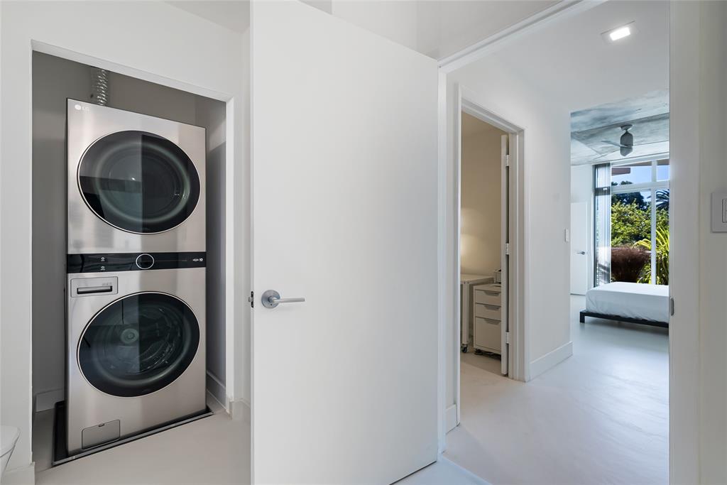 2001 Meridian Avenue, Unit 318 Miami Beach, FL 33139 - Photo 24 of 37 a view of a hallway with washer and dryer