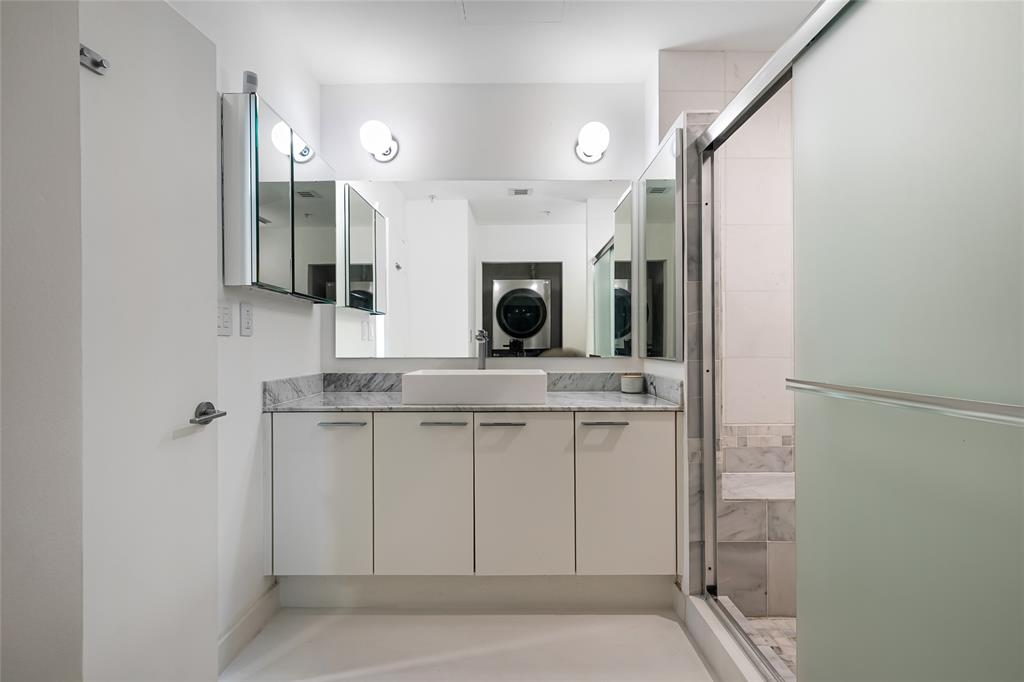 2001 Meridian Avenue, Unit 318 Miami Beach, FL 33139 - Photo 26 of 37 a bathroom with a sink and a mirror