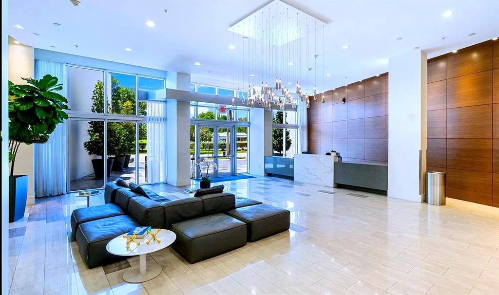 2001 Meridian Avenue, Unit 318 Miami Beach, FL 33139 - Photo 34 of 37 a living room with furniture and a large window