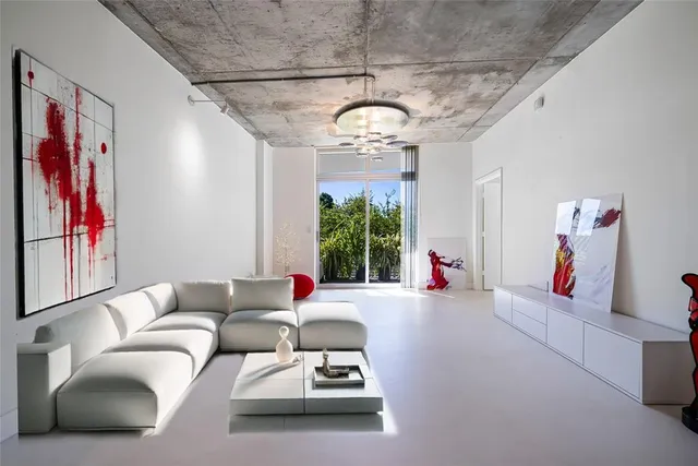 a view of gym equipment with a chandelier