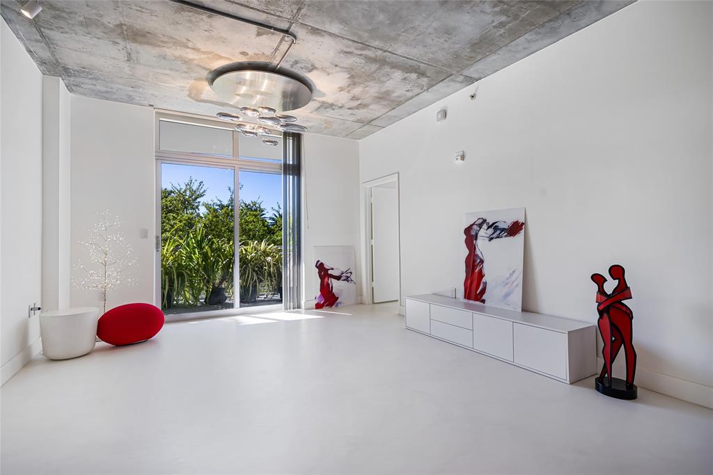 2001 Meridian Avenue, Unit 318 Miami Beach, FL 33139 - Photo 7 of 37 a view of gym equipment with a chandelier