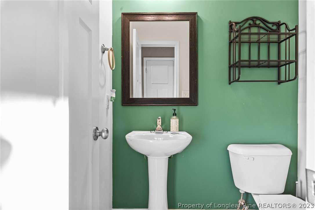 108 Roy's Ridge Raeford, NC 28376 - Photo 16 of 32 a bathroom with a toilet sink and mirror