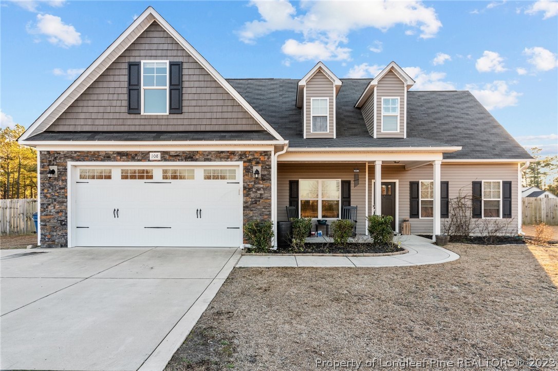 108 Roy's Ridge Raeford, NC 28376 - Photo 2 of 32 a front view of a house with a yard