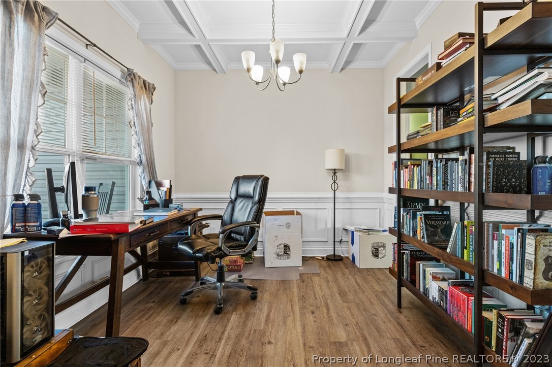 108 Roy's Ridge Raeford, NC 28376 - Photo 5 of 32 a view of a workspace with furniture and a book shelf