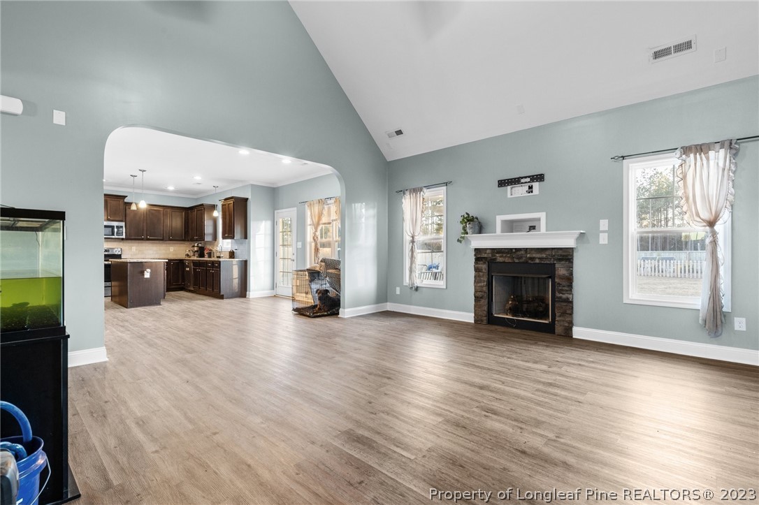 108 Roy's Ridge Raeford, NC 28376 - Photo 8 of 32 a view of empty room with fireplace and wooden floor