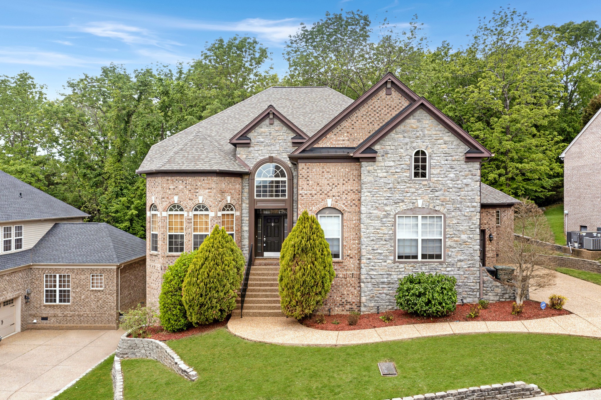 front view of a house with a yard