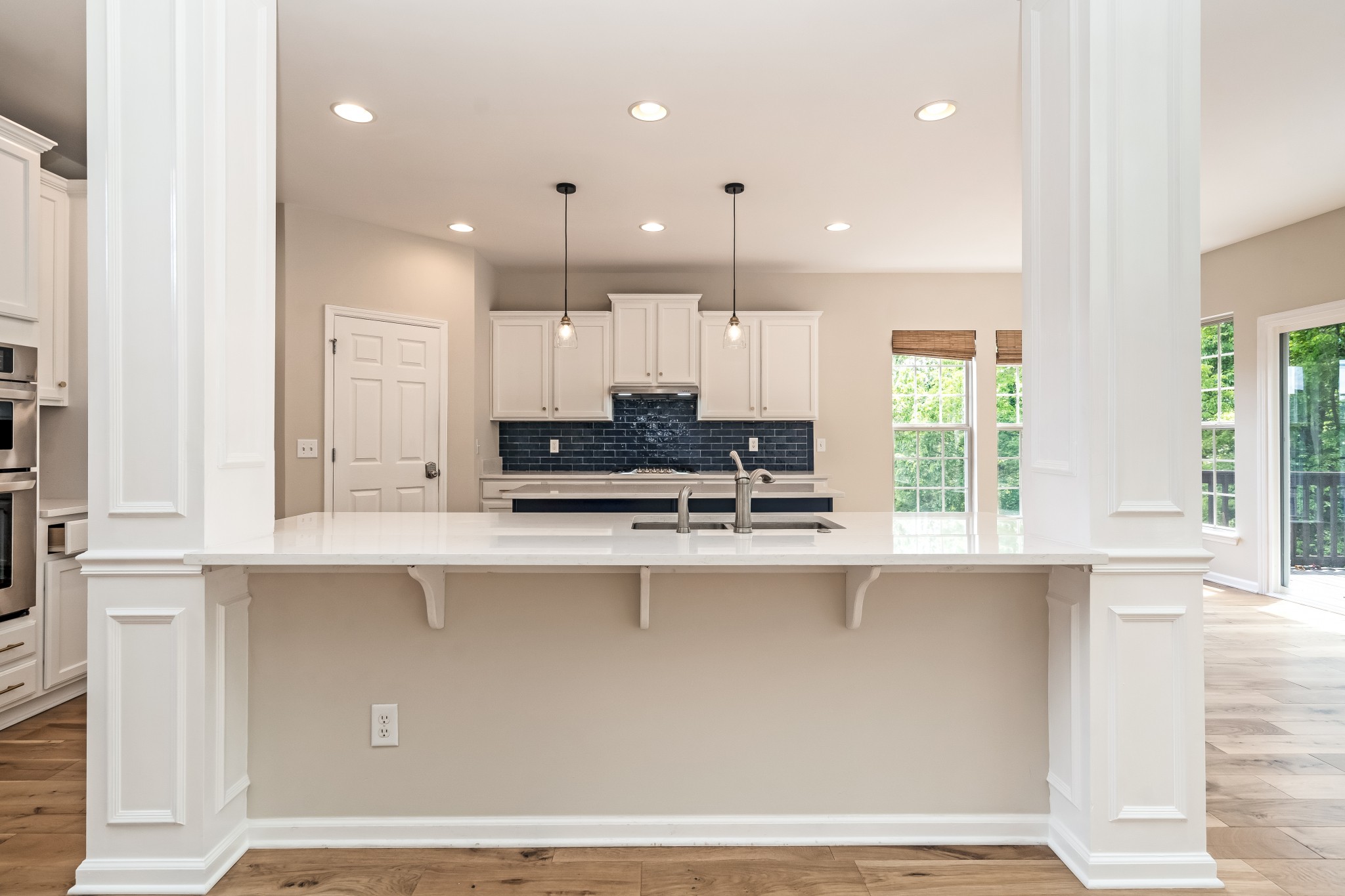 1508 Simpson Court Nashville, TN 37211 - Photo 13 of 41 a large kitchen with stainless steel appliances a large counter top a stove and a window