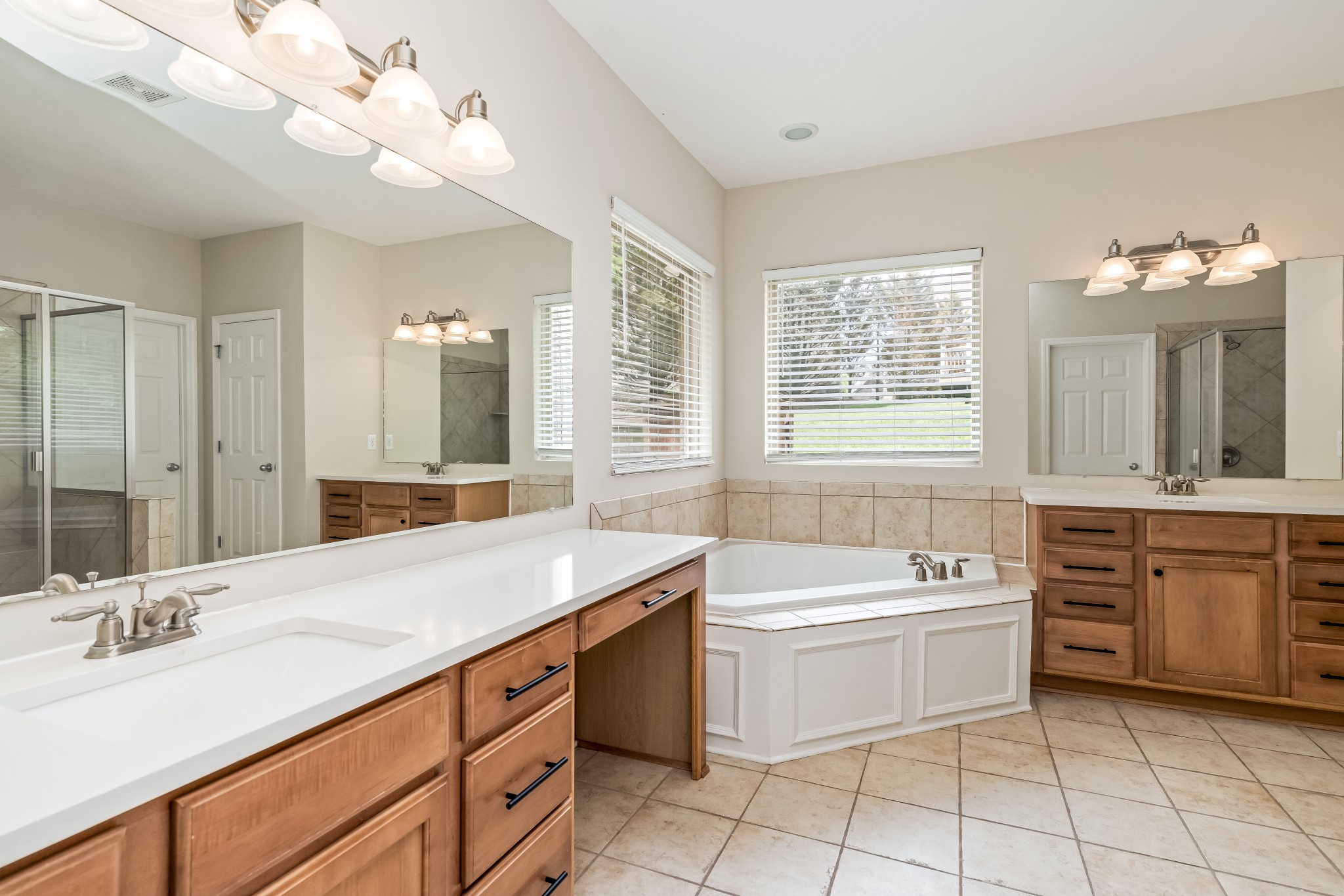 1508 Simpson Court Nashville, TN 37211 - Photo 16 of 41 a bathroom with a tub a sink double vanity and a mirror