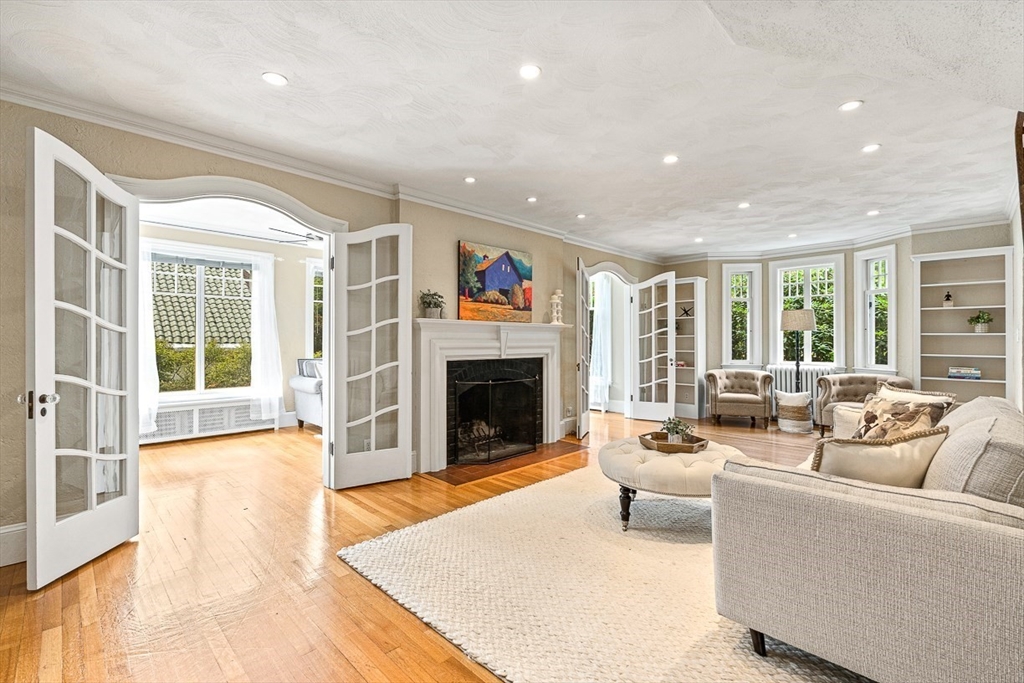 24 Calumet Road Winchester, MA 01890 - Photo 13 of 41 a living room with furniture large window and a fireplace