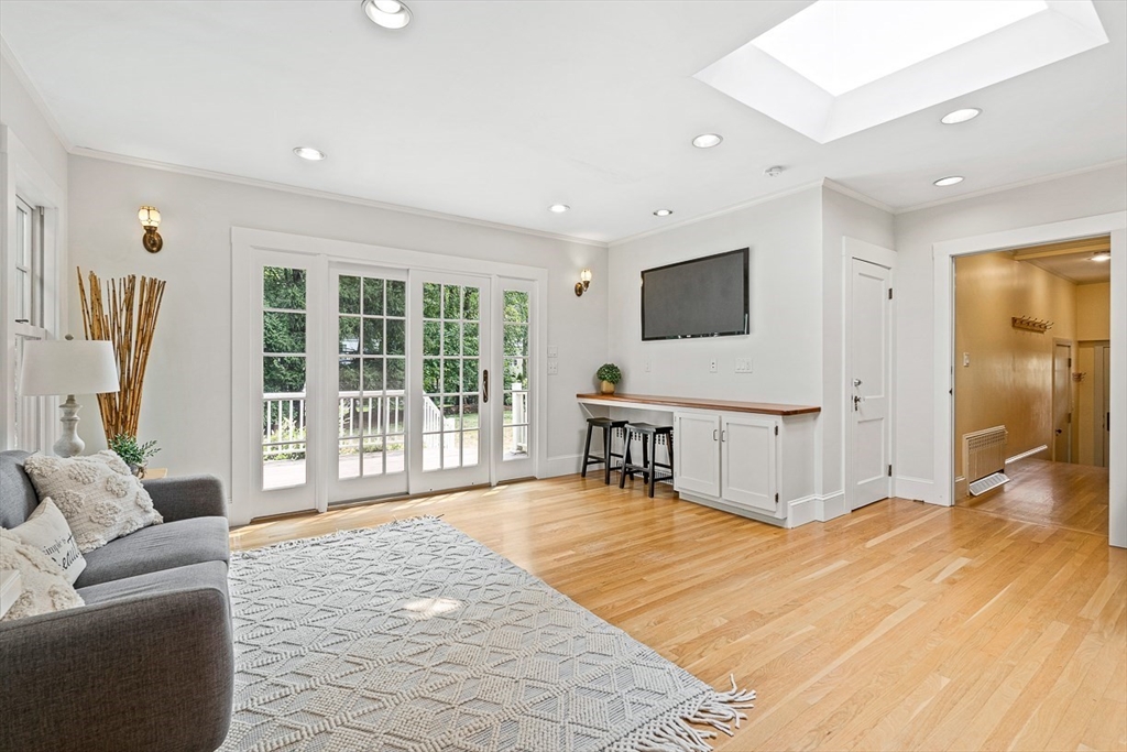 24 Calumet Road Winchester, MA 01890 - Photo 22 of 41 a living room with a large window and a flat screen tv