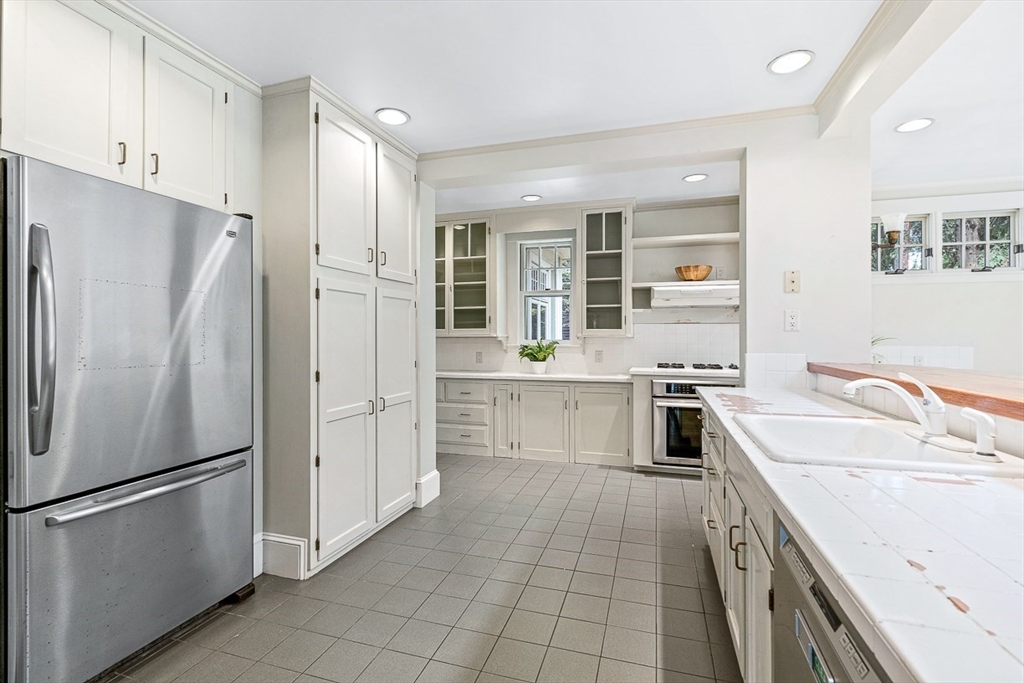 24 Calumet Road Winchester, MA 01890 - Photo 25 of 41 a kitchen with a refrigerator sink and stainless steel appliances