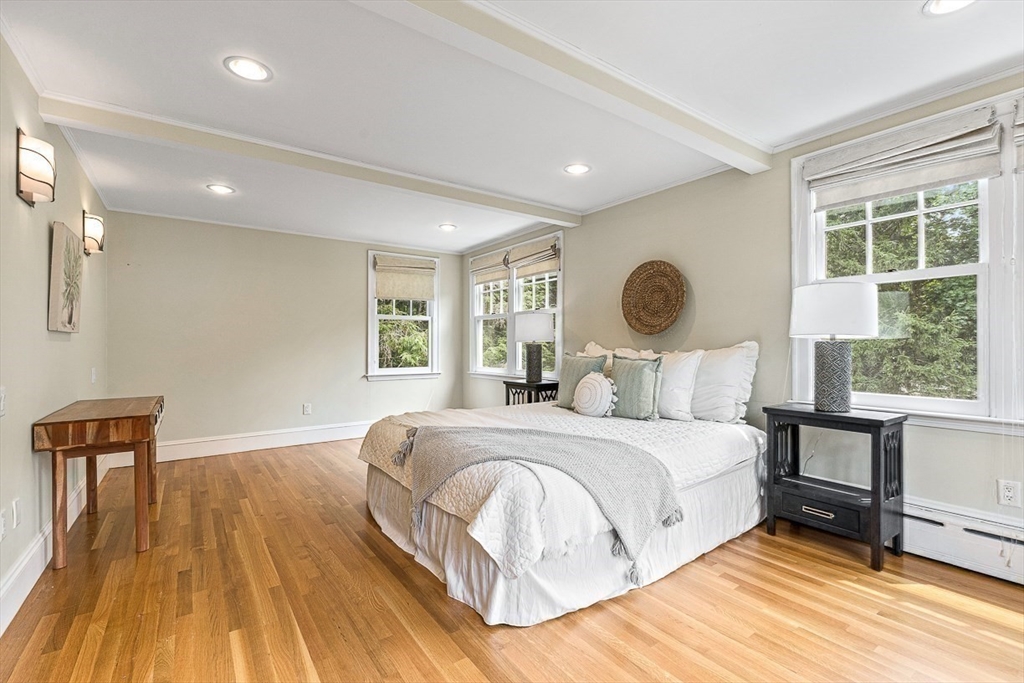 24 Calumet Road Winchester, MA 01890 - Photo 29 of 41 a bedroom with a large bed and a large window