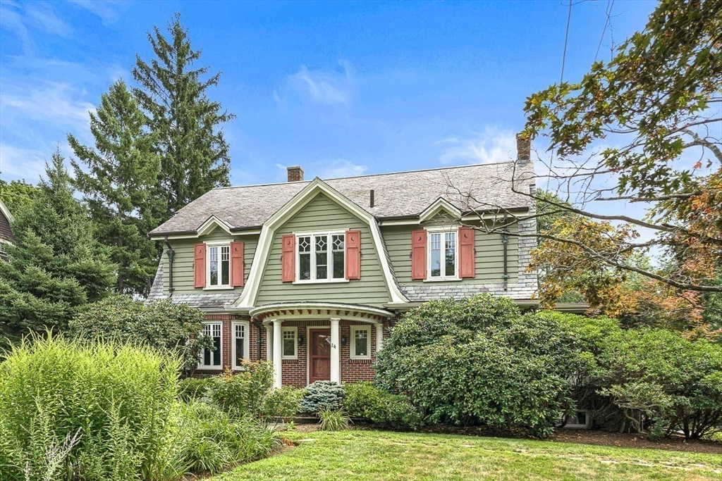 24 Calumet Road Winchester, MA 01890 - Photo 3 of 41 a front view of a house with a yard