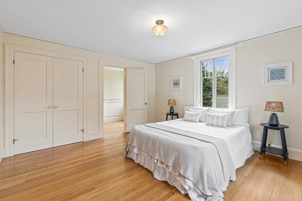 24 Calumet Road Winchester, MA 01890 - Photo 33 of 41 a bedroom with a bed and a window