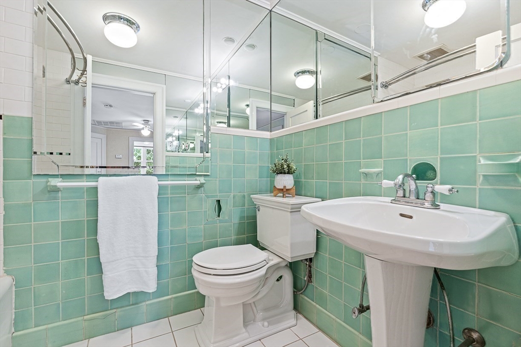 24 Calumet Road Winchester, MA 01890 - Photo 36 of 41 a bathroom with a sink toilet and shower