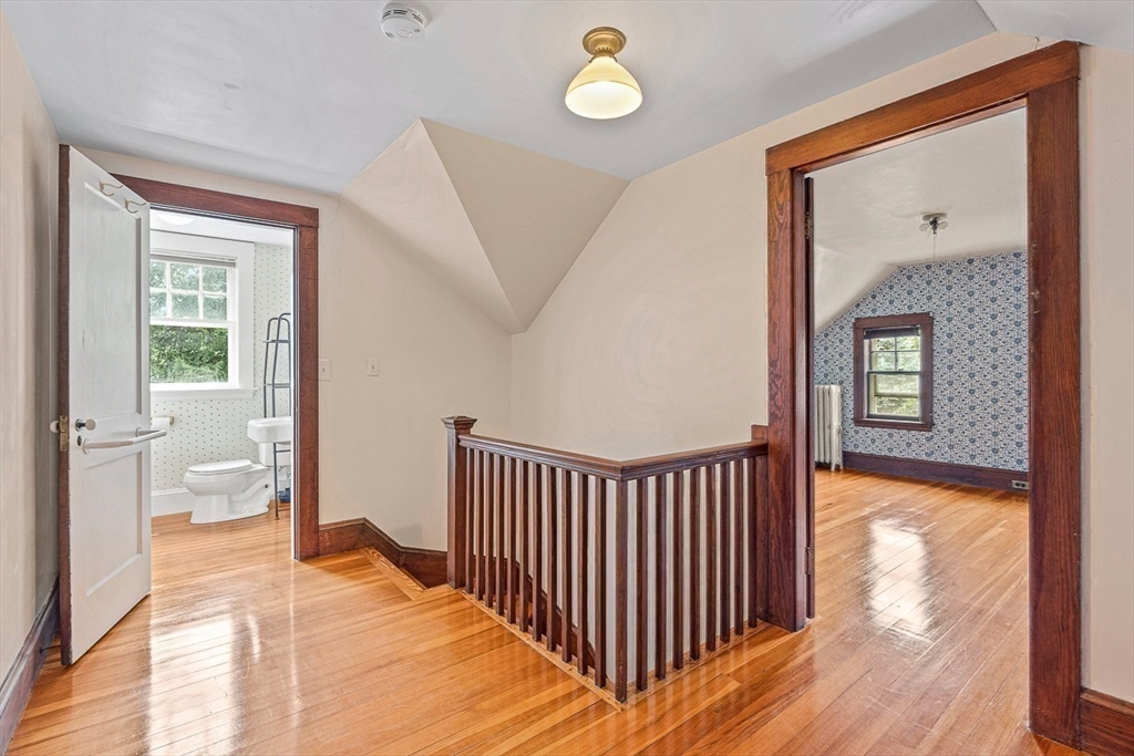 24 Calumet Road Winchester, MA 01890 - Photo 37 of 41 a bedroom with a bed and wooden floor