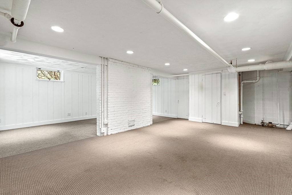 24 Calumet Road Winchester, MA 01890 - Photo 40 of 41 an empty room with a cabinet and mirrors