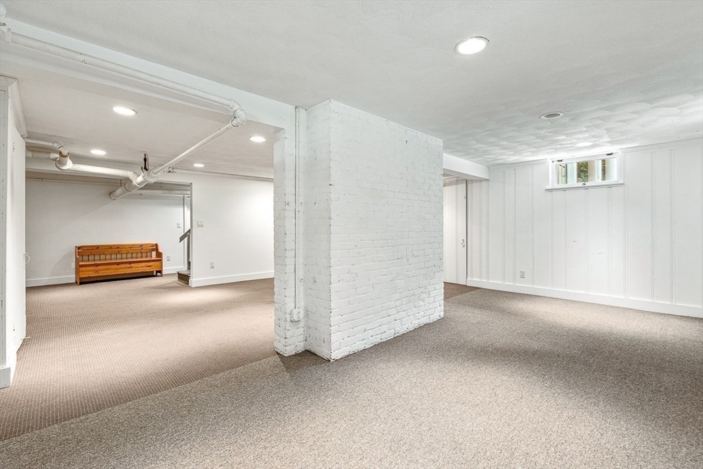 24 Calumet Road Winchester, MA 01890 - Photo 41 of 41 en empty room with windows and ceiling fan