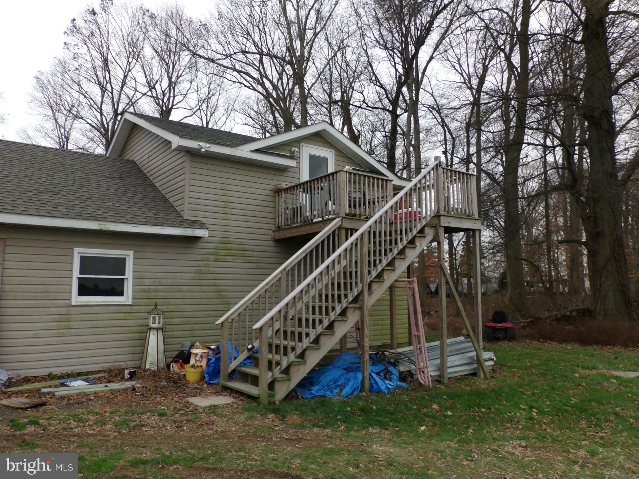 29012 Rabbit Hill Road Easton, MD 21601 - Photo 19 of 22 a view of a house with a yard