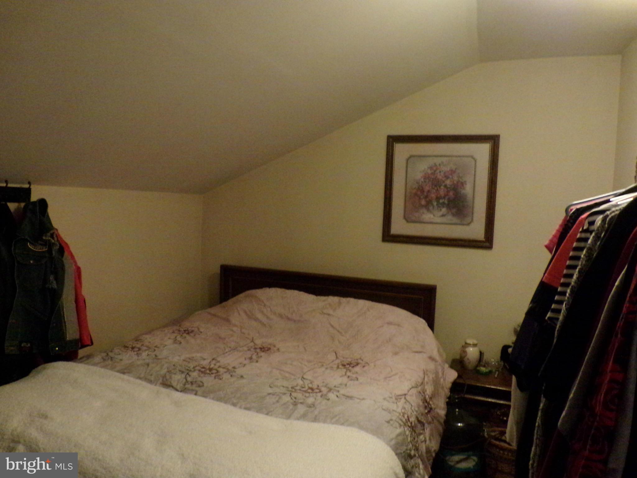 29012 Rabbit Hill Road Easton, MD 21601 - Photo 22 of 22 a bedroom with a bed and a walk in closet