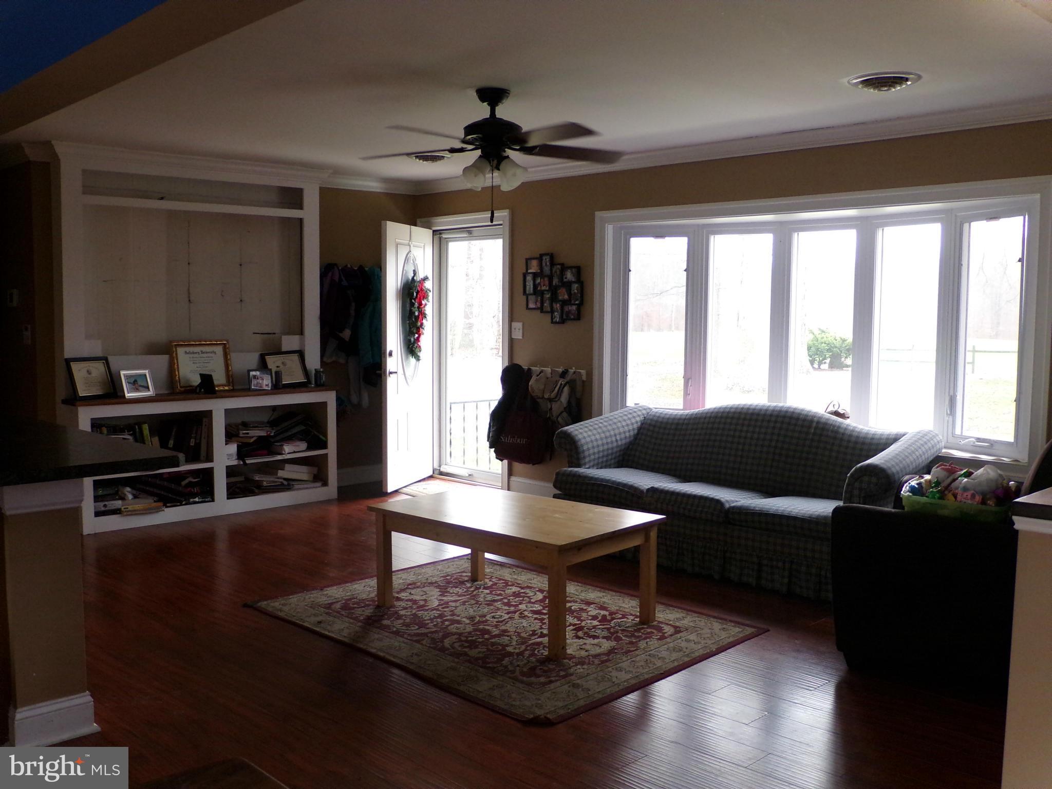29012 Rabbit Hill Road Easton, MD 21601 - Photo 10 of 22 a living room with furniture and wooden floor