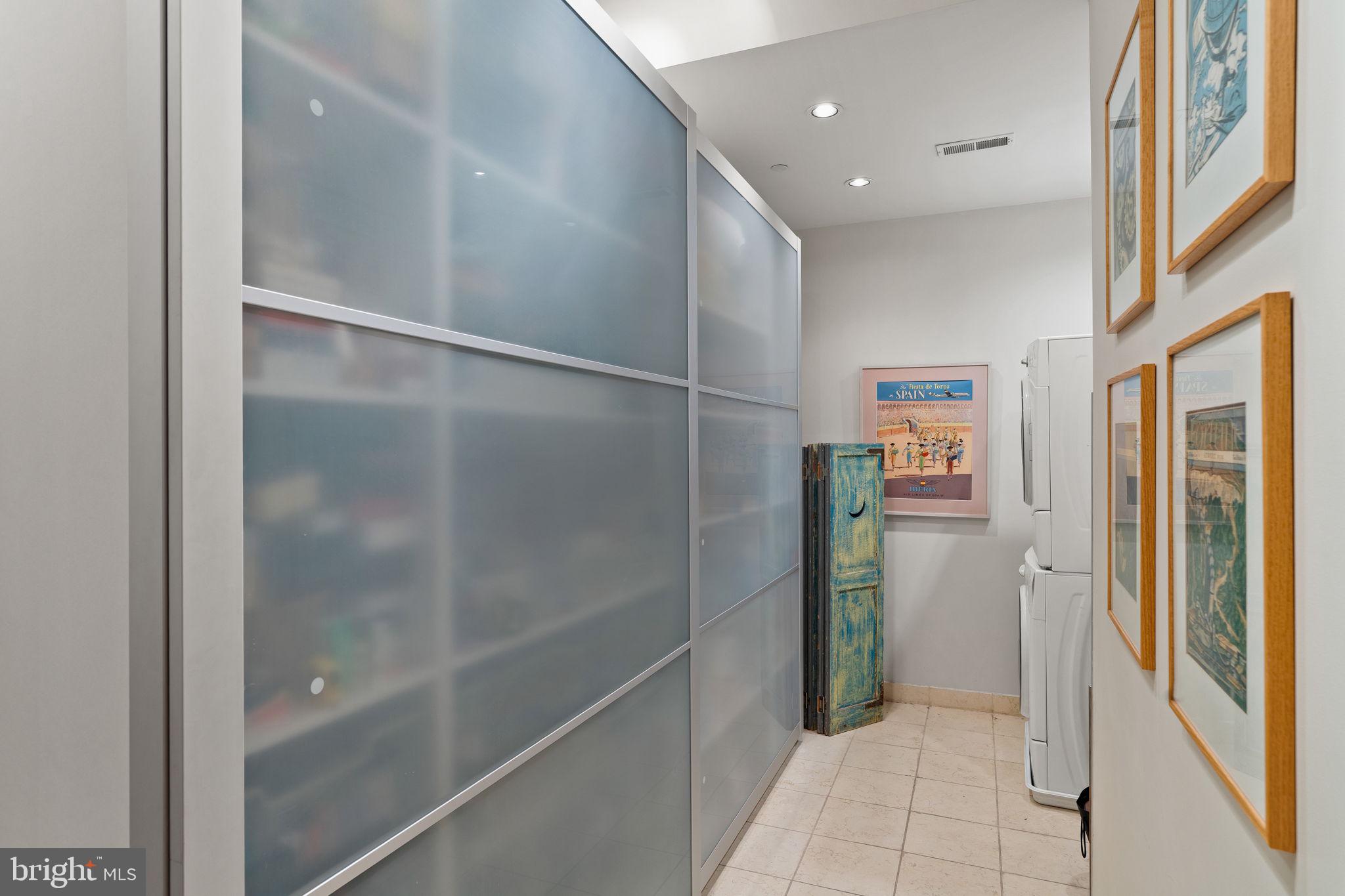 1606 Chestnut Street, Unit 2 Philadelphia, PA 19103 - Photo 39 of 60 Walk-in laundry area with wall of storage
