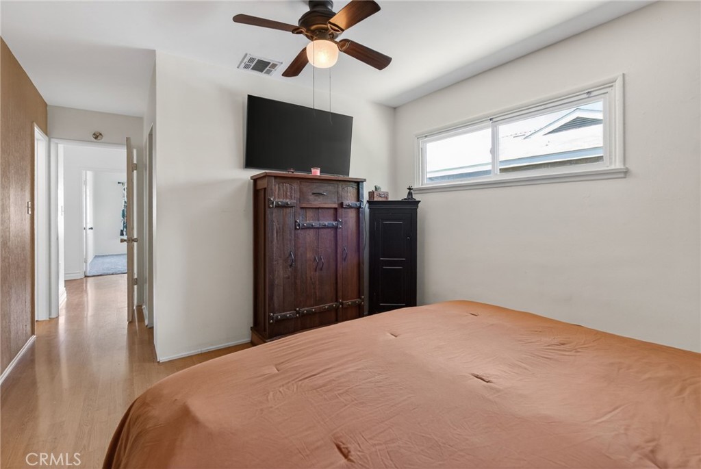4194 Euclid Court Riverside, CA 92504 - Photo 16 of 29 Alternate view of primary bedroom with ceiling fan and a walk-in closet!
