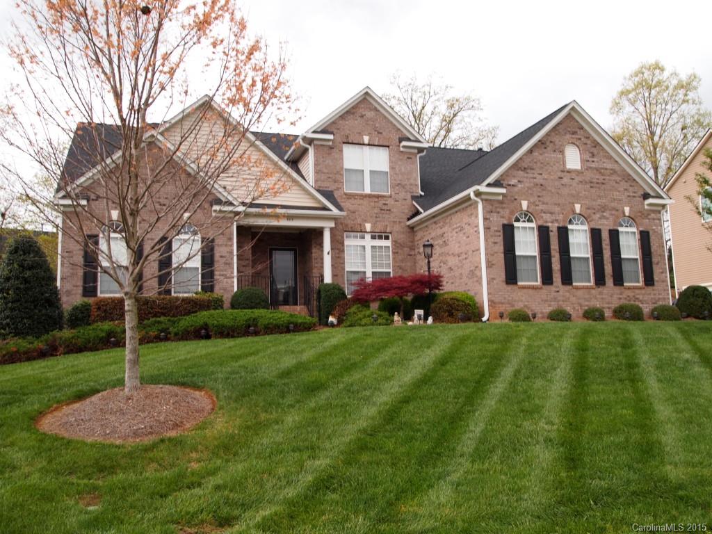 603 Panthers Way, Unit 190 Fort Mill, SC 29708 - Photo 1 of 17 a front view of a house with a yard and trees