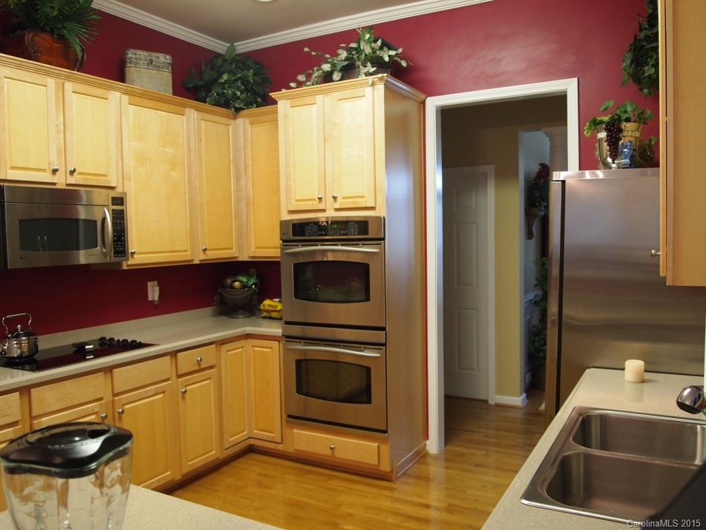 603 Panthers Way, Unit 190 Fort Mill, SC 29708 - Photo 2 of 17 a kitchen with stainless steel appliances a stove a sink and a microwave