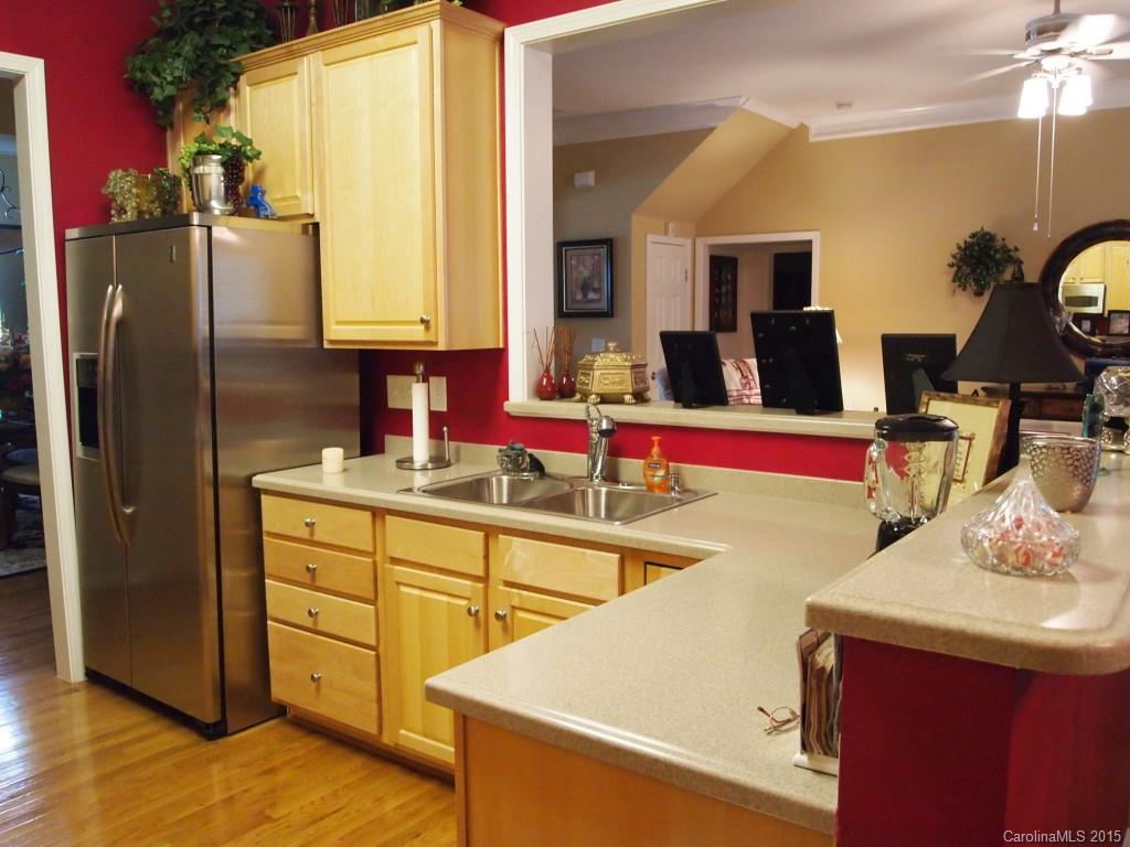 603 Panthers Way, Unit 190 Fort Mill, SC 29708 - Photo 3 of 17 a kitchen with stainless steel appliances granite countertop a sink stove and refrigerator