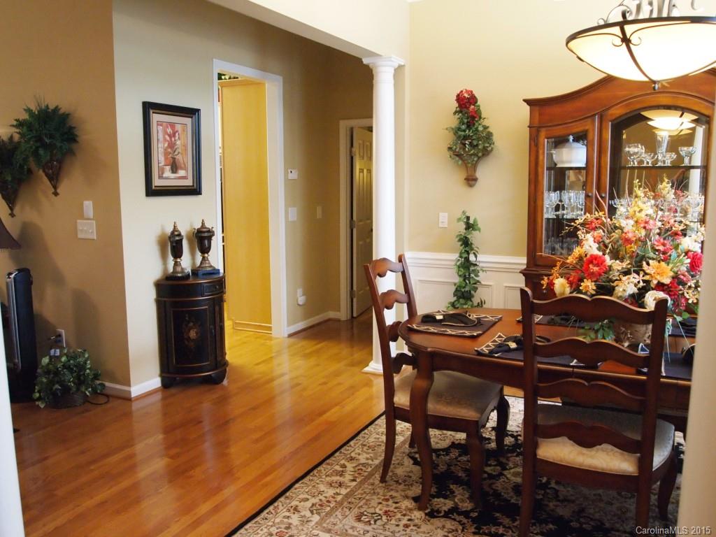 603 Panthers Way, Unit 190 Fort Mill, SC 29708 - Photo 5 of 17 a view of a dining room with furniture and wooden floor