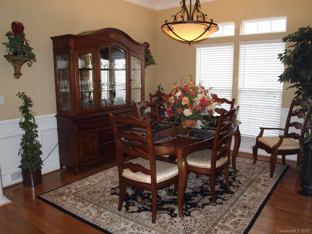 603 Panthers Way, Unit 190 Fort Mill, SC 29708 - Photo 6 of 17 a view of a dining room with furniture and wooden floor