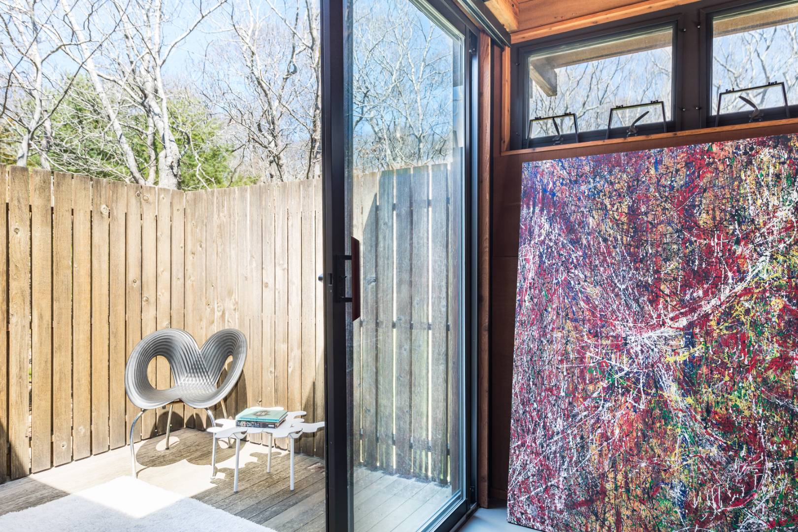 131 Windward East Hampton, NY 11937 - Photo 16 of 22 a view of a bathroom with a door and mirror